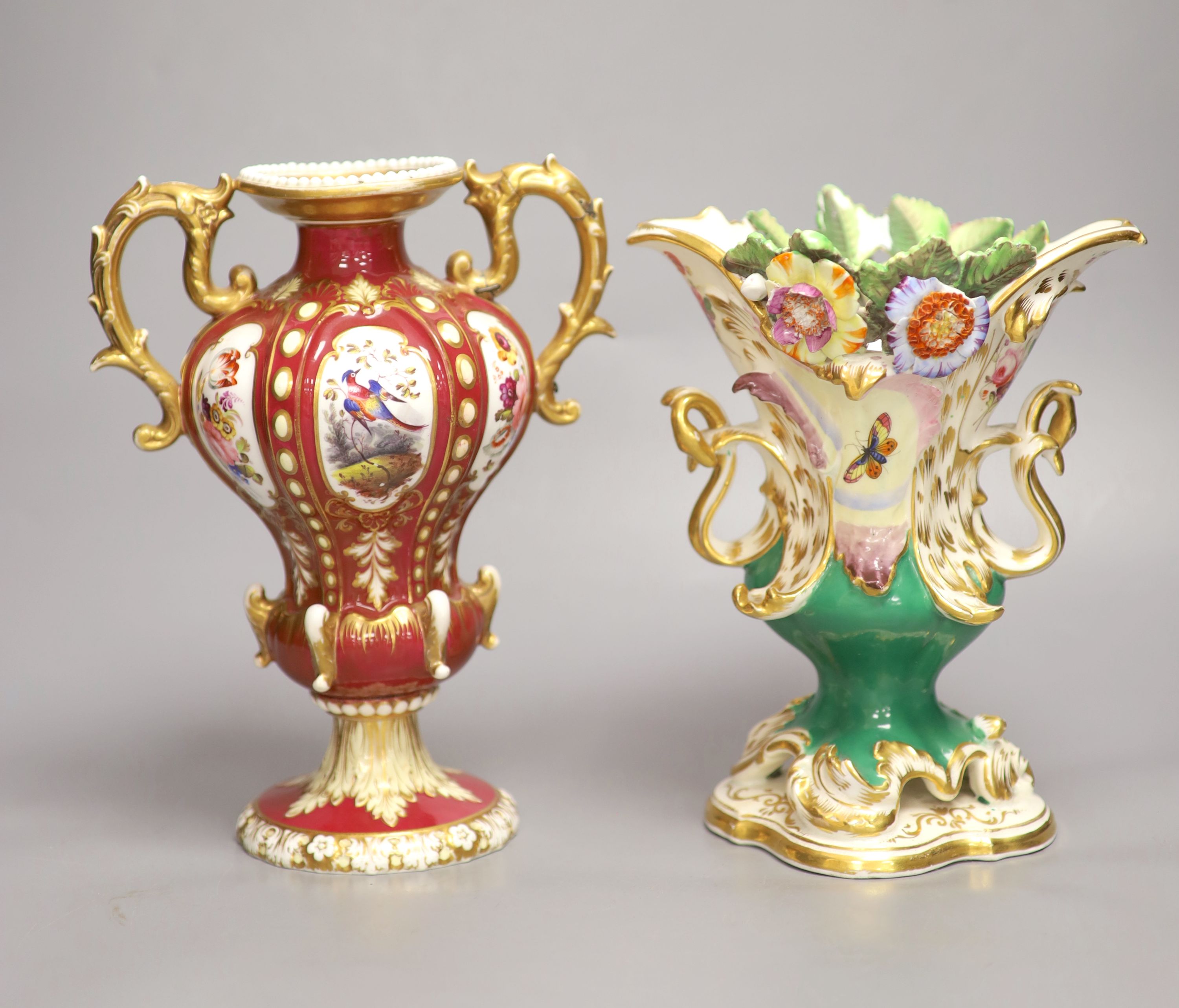 A Coalport two handled vase, with moulded leaves, CD mark in blue and an English crimson ground two handled vase, tallest 23cm